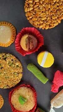 Top view of assorted traditional Mexican candies on a dark background