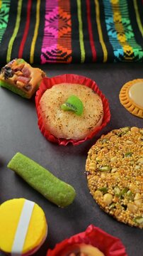 Variety of traditional Mexican sweets on a dark background with artisanal textile