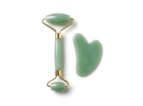 Jade Face Roller and Gua Sha Stone on White Background