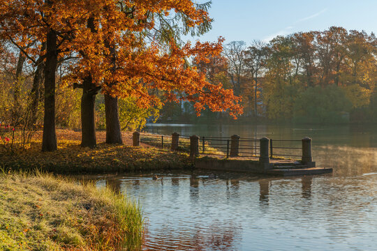 Stone pier on the shore of the Great Pond in the Catherine Park of Tsarskoye Selo on a sunny autumn morning, Pushkin, St. Petersburg, Russia