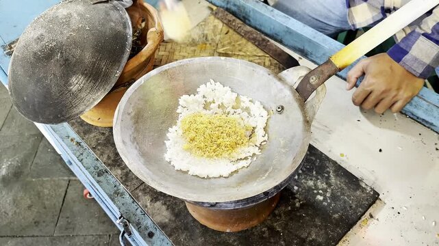 The process of making egg crust, using duck eggs. a traditional food from Jakarta, Indonesia. Culinary tourism, culinary. Kerak telur. Kerak telur. Kerak telor. Betawi. 