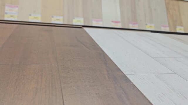 Flooring options are displayed in a store with different colors and patterns