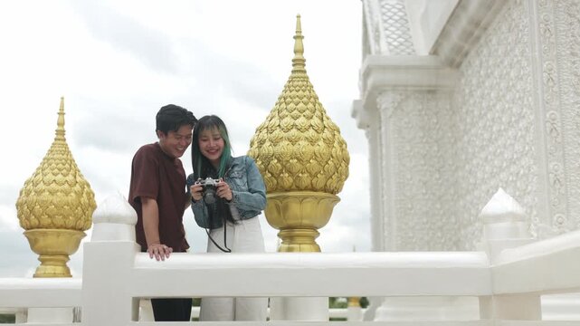 Asian Tourists Walking Past White Sanctuary Part 147
