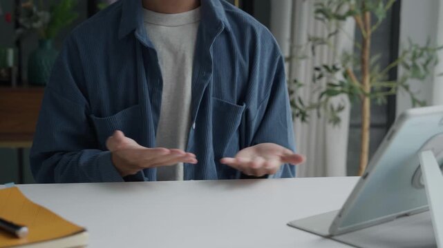 Asian man learning to using sign language