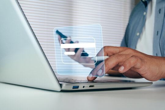 Business professional using virtual credit card interface on laptop for secure digital payment, online transactions, fintech services, electronic commerce, cashless operations, financial technology