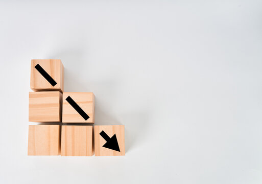 Cubes arranged as descending steps with diagonal marks and a downward arrow isolated on white background
