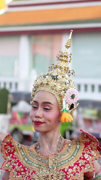 Traditional Thai Dancer in Ornate Costume and Golden Chada Headdress