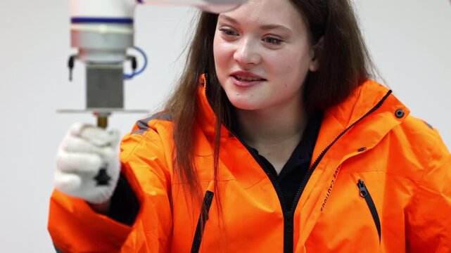 Female industrial engineer study inspection control robot arm machine in robotics engineering, Robotic learn operating, programming, troubleshooting quality control demonstrations of robotic arms. AI