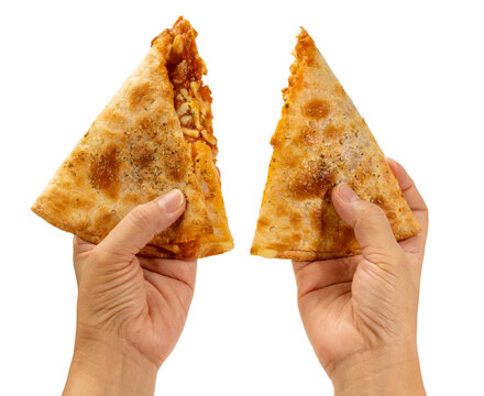 Hands holding crispy pizza puff isolated on white background with clipping path, savory baked snack with melted filling, ideal for fast food advertising and takeaway.