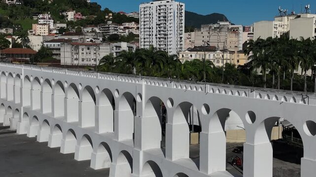 Aqueduct Arch in Lapa, Rio de Janeiro, Brazil. Arcos da Lapa in aerial view, establishing shot.