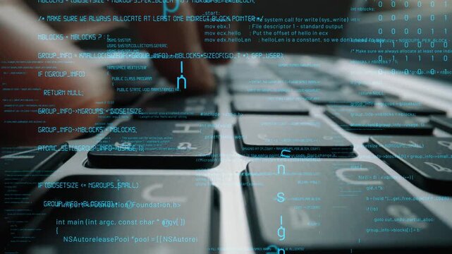 A close-up view of hands actively typing on a laptop keyboard, layered with digital code. This image captures the essence of modern technology and cyber security in action. Xenic