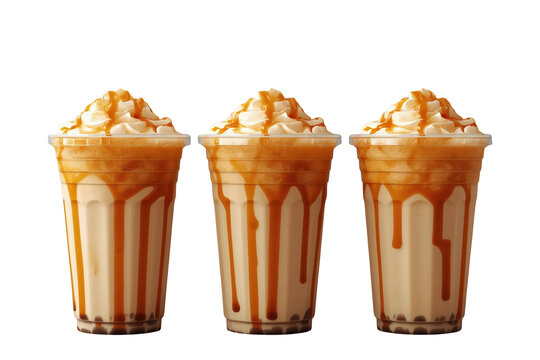Three caramel frappes in plastic cups with whipped cream and drizzle for a sweet dessert beverage, transparent background
