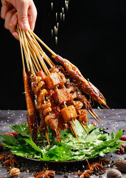 Grilled Meat and Seafood Skewers with Sesame Seeds - Asian Street Food Barbecue