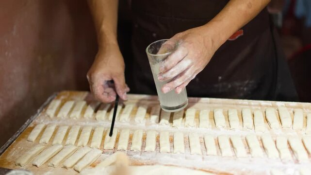 Asian Street Food Chef Preparing Dough for Traditional Fried Bread Sticks