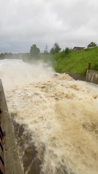The rapid flow of water at the dam. Heavy rains, heavy flooding, lots of water. Global warming