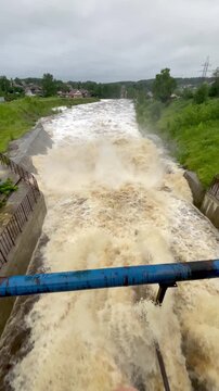 The rapid flow of water at the dam. Heavy rains, heavy flooding, lots of water. Global warming