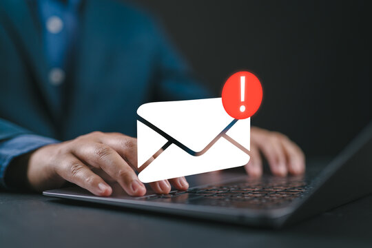 Person typing on a laptop with email alert notification icon. Concept of incoming message, email communication, urgent inbox update, digital marketing, customer engagement and business technology.