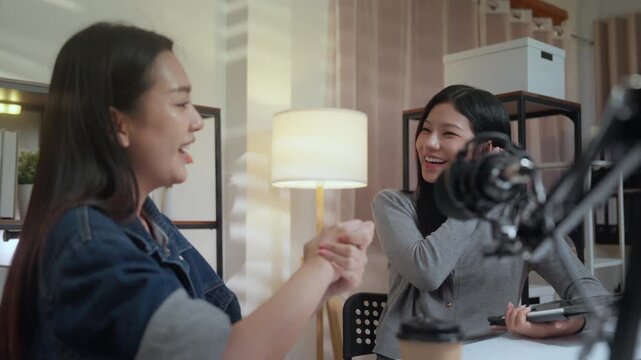 Podcast studio microphone interview content creator storytelling conversation recording talk in cozy home studio, two women share ideas as host and guest, clear voice and candid flow for audience