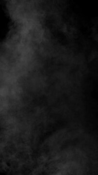 Heavy, dense fog cloud drifts slowly across the top half of black screen. Atmospheric background or overlay for moody, dramatic scenes, vertical format