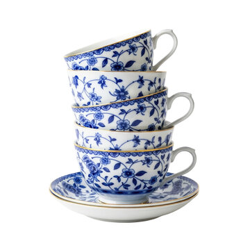 A beautiful stack of vintage blue and white porcelain tea cups with floral patterns on a matching saucer.