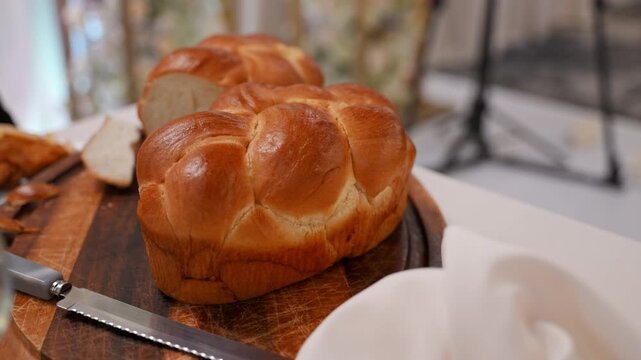 Traditional Jewish wedding ceremony moment with challah bread 