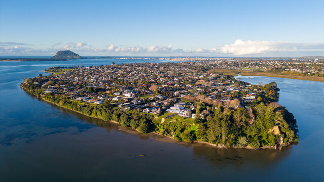 Matua, a suburb of Tauranga, New Zealand, photographed from the air. On the horizon is Mount Maunganui