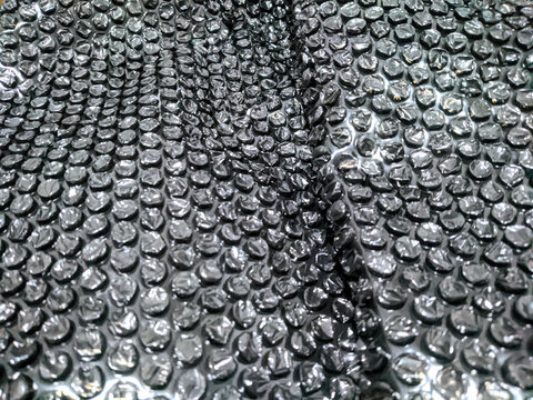 Black bubble wrap texture background for protective packaging