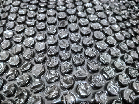 Black bubble wrap texture background for protective packaging
