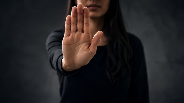 Man Showing Stop Hand Gesture, Personal Boundaries, Rejection, Protection and Awareness Concept on Dark Background