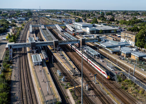 Peterborough Railway Station, Peterborough, Cambridgeshire, England, aerial view of the major East Coast Main Line railway station with platforms, trains and surrounding city centre.