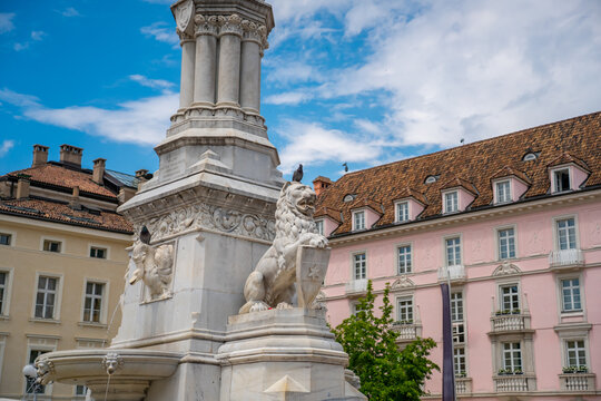 Walther Square Monument with marble lions in the historic center of Bolzano, South Tyrol, Italy