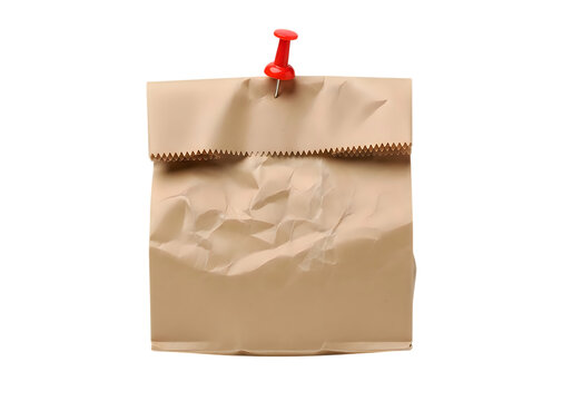 Crumpled brown paper lunch bag pinned to a black background, with a bright, red plastic push, pin, centered view, of a folded sack