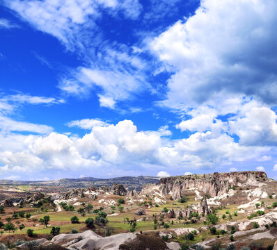 Landscape of world-famous fairy chimneys and mushroom-shaped rocks. Symbol of Cappadocia - Fairy Chimney (Multihead stone mushrooms), Pasabag Valley, Anatolia, Turkey. Topic of travel, trip, vacation