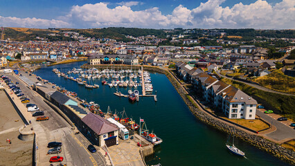 Aerial view of harbor channel marina boats and waterfront buildings © Андрей Нелупов