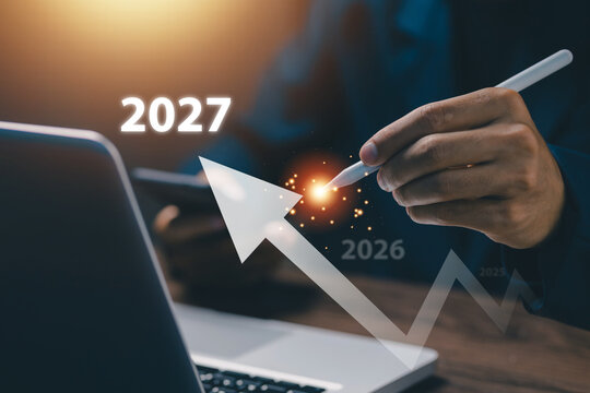 Business professional planning growth strategy for 2027 using digital technology, highlighting future trends, financial success, business development, forecasting, and performance improvement.