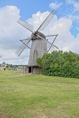 Obraz premium Unique Dutch style wooden windmill built in 1927, located at Angla Windmill Park located on Saaremaa Island in Estonia, Europe.