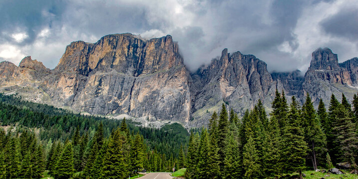 Dolomites  mountain in Italy south of Tyrol, from Canazei with famous rocky peaks background under cloudy  sky