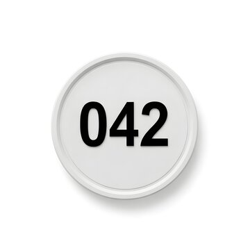 A close-up view of a round button labeled with the number zero forty-two isolated on white background