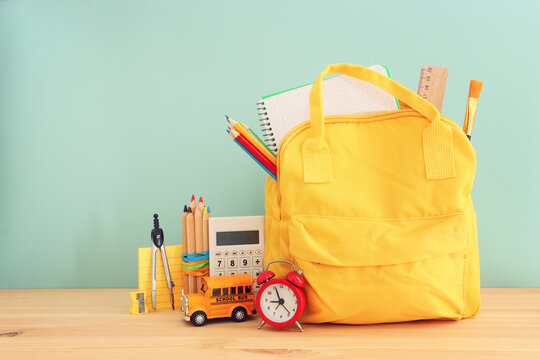 Back to school concept over pastel background. Top view