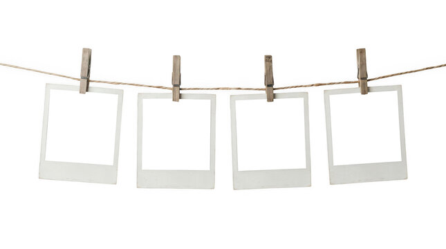 Four empty polaroid photos on a clothesline isolated on transparent background
