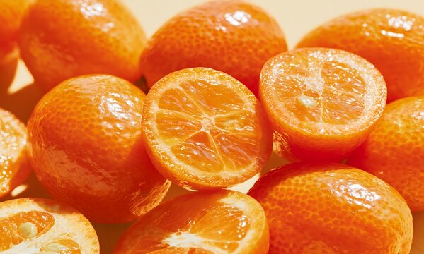 macro fruit portrait of ripe kumquat citrus, oversized tiny orange citrus filling most of the frame