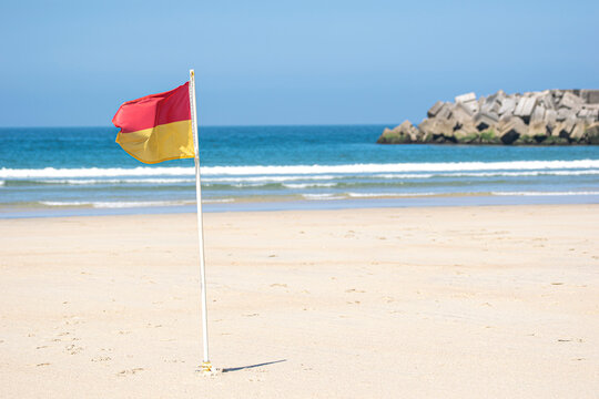 Beach warning flag waving in the wind The Concept of coastal security