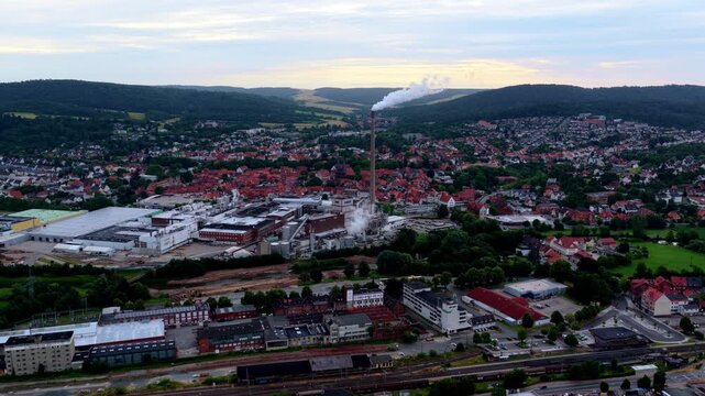 Alfeld, Lower Saxony, Germany - June 30, 2026: Zoom-In Aerial Video of Sappi Paper Mill in Alfeld, Germany