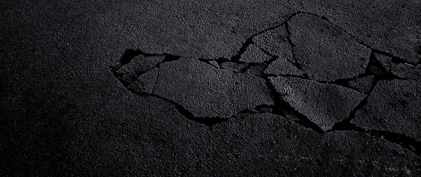 Cracked asphalt pavement road. Damaged and cracked dark asphalt road background, Pavement cracks, Damaged road surface. not ai