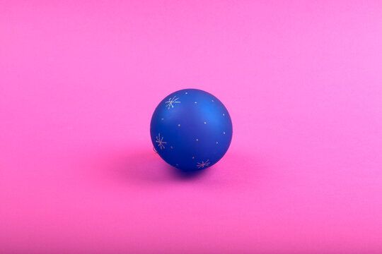 New Year's tree toy on a pink background