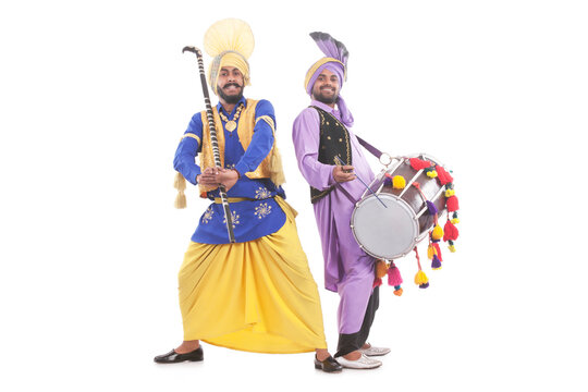 Portrait of Sikh men doing bhangra dance