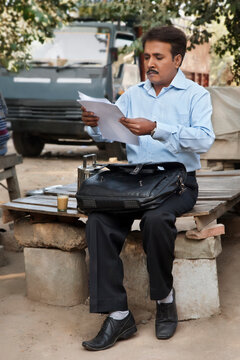 Salesman examining his paperwork
