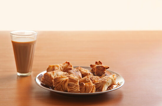 Glass of tea with khari biscuits