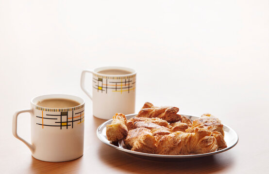 Two tea cups with khari biscuits