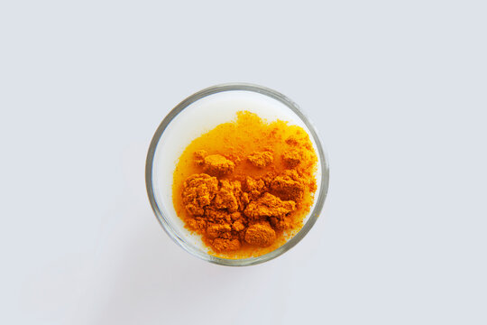 Overhead View of Glass of milk with turmeric powder